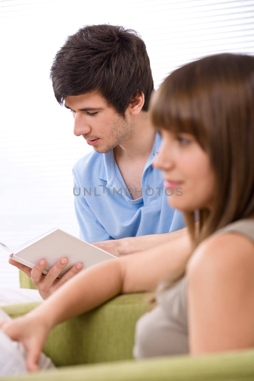 Student - two teenager reading book home