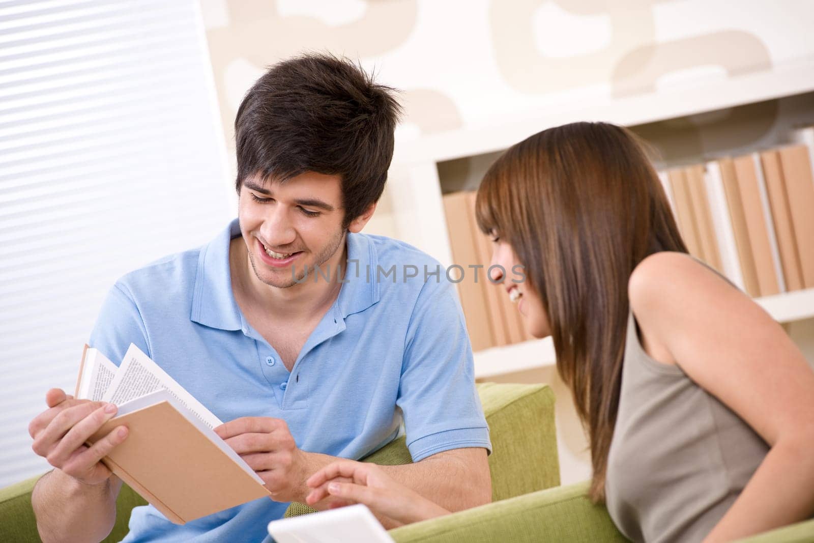Student - two teenager reading book home