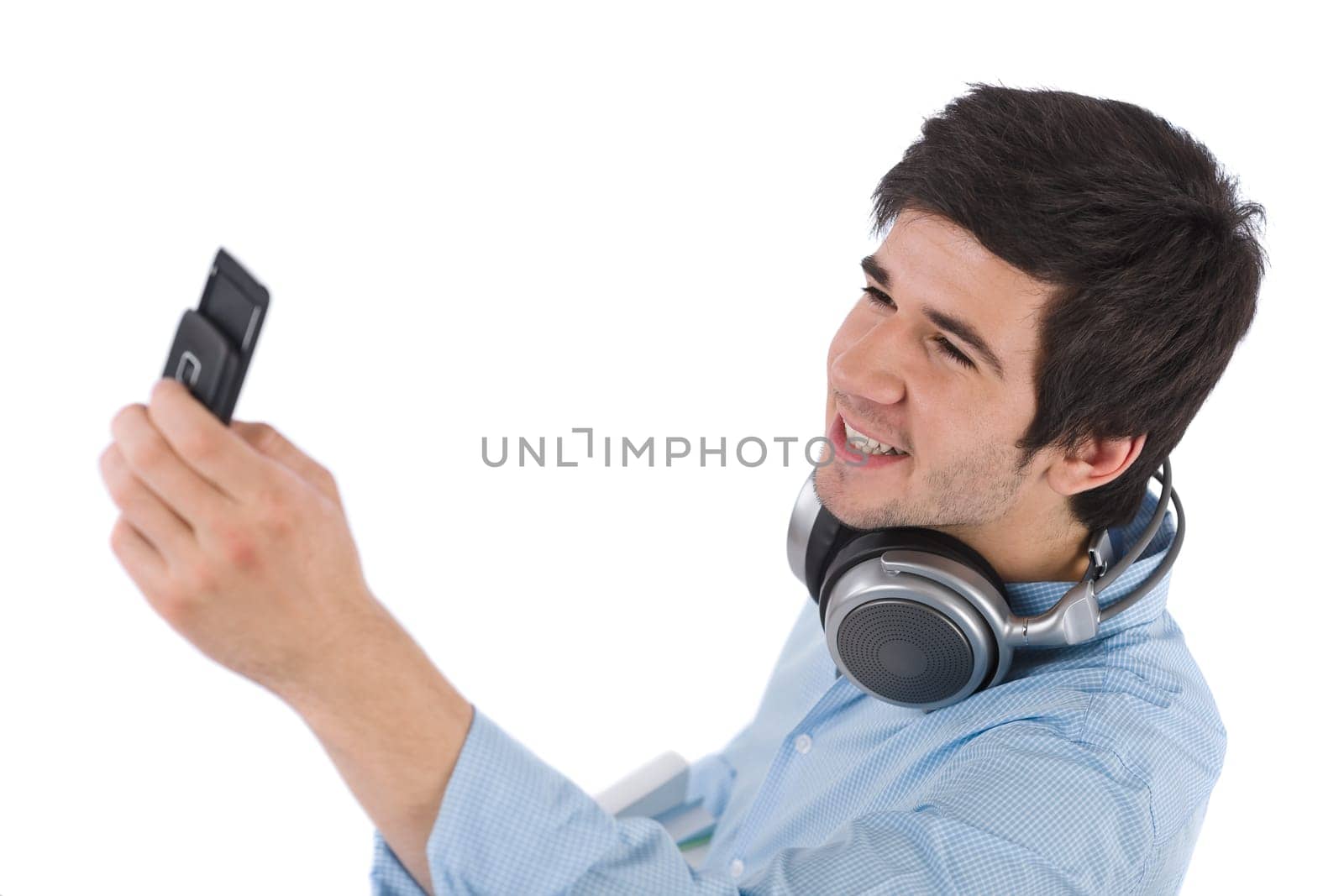 Male student taking photo with mobile phone