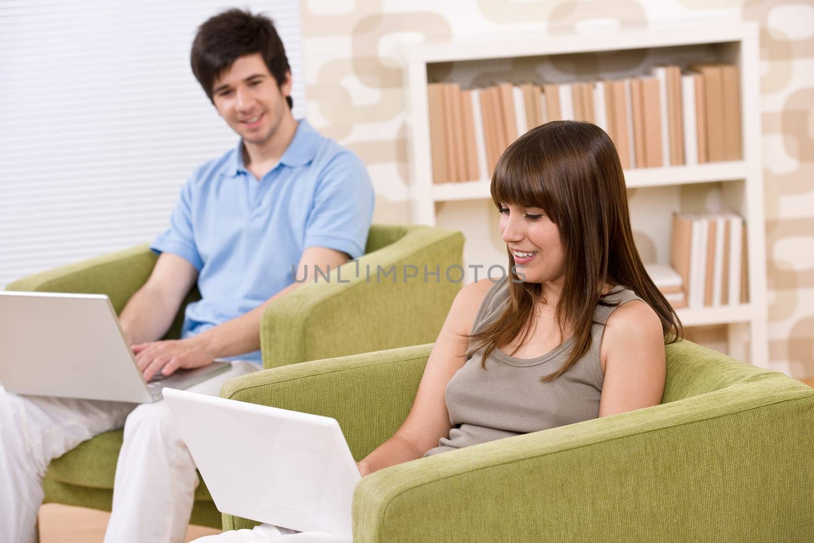 Student - two teenager with laptop in living room