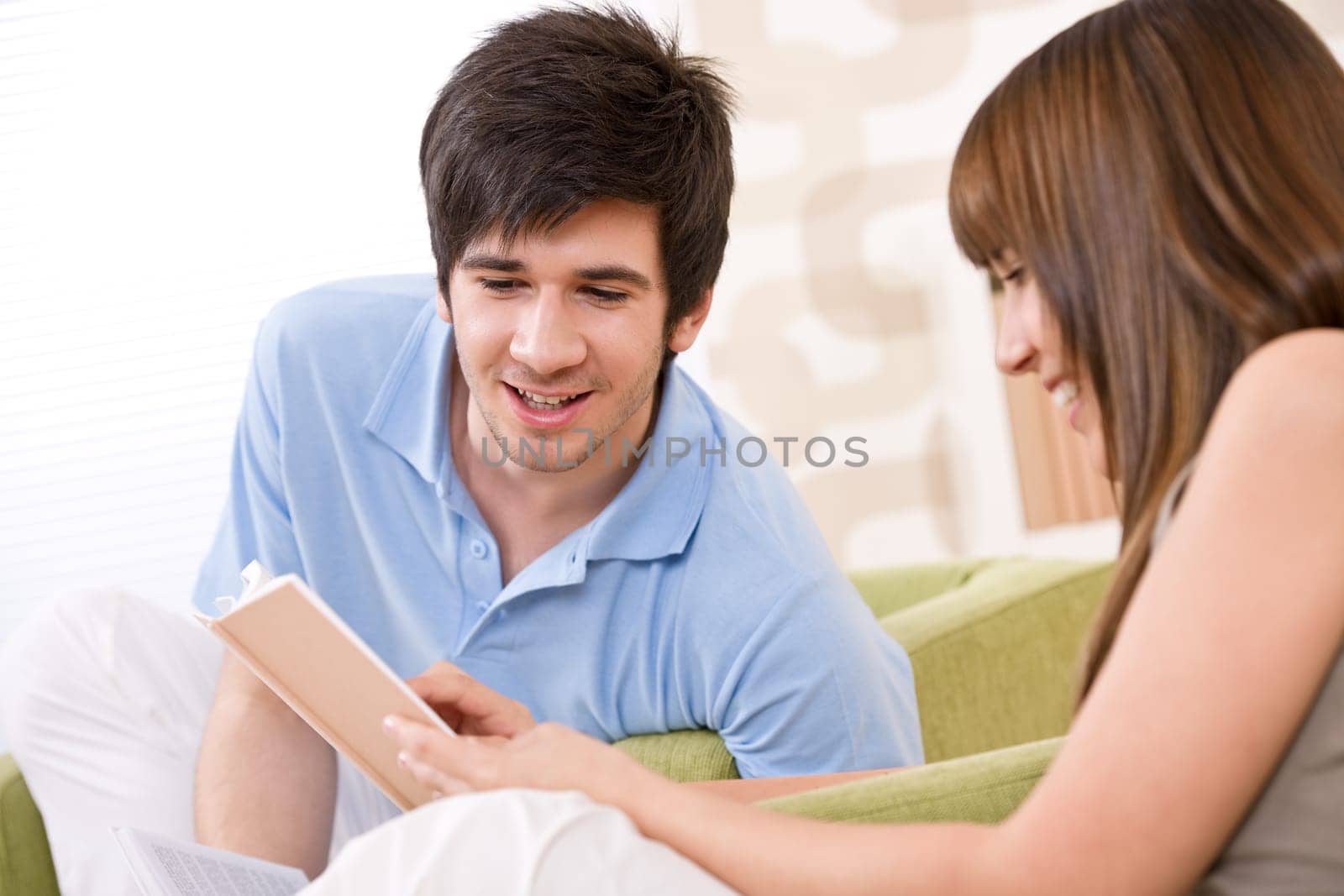 Student - two teenager reading book home
