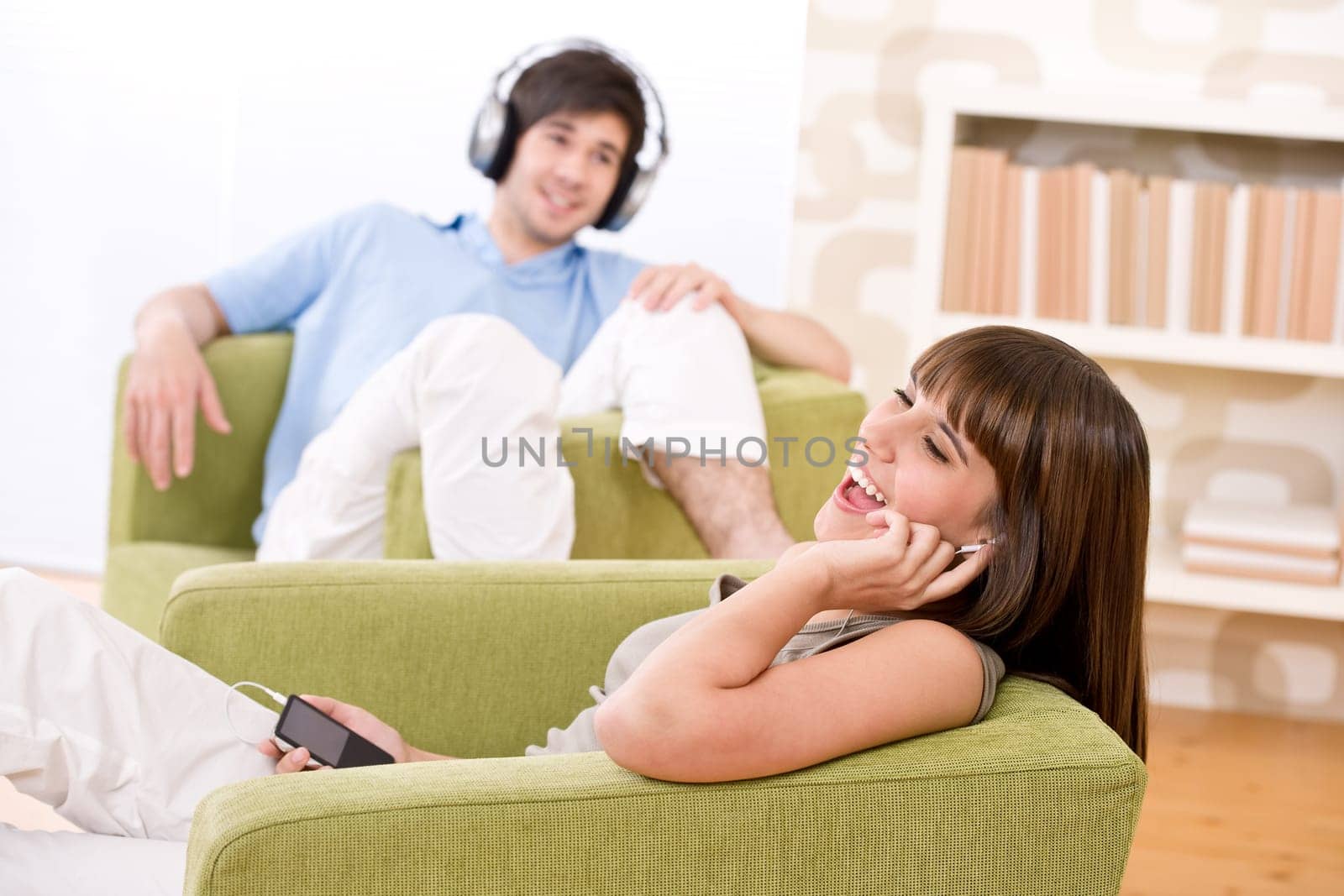 Students - Happy teenagers listen to music
