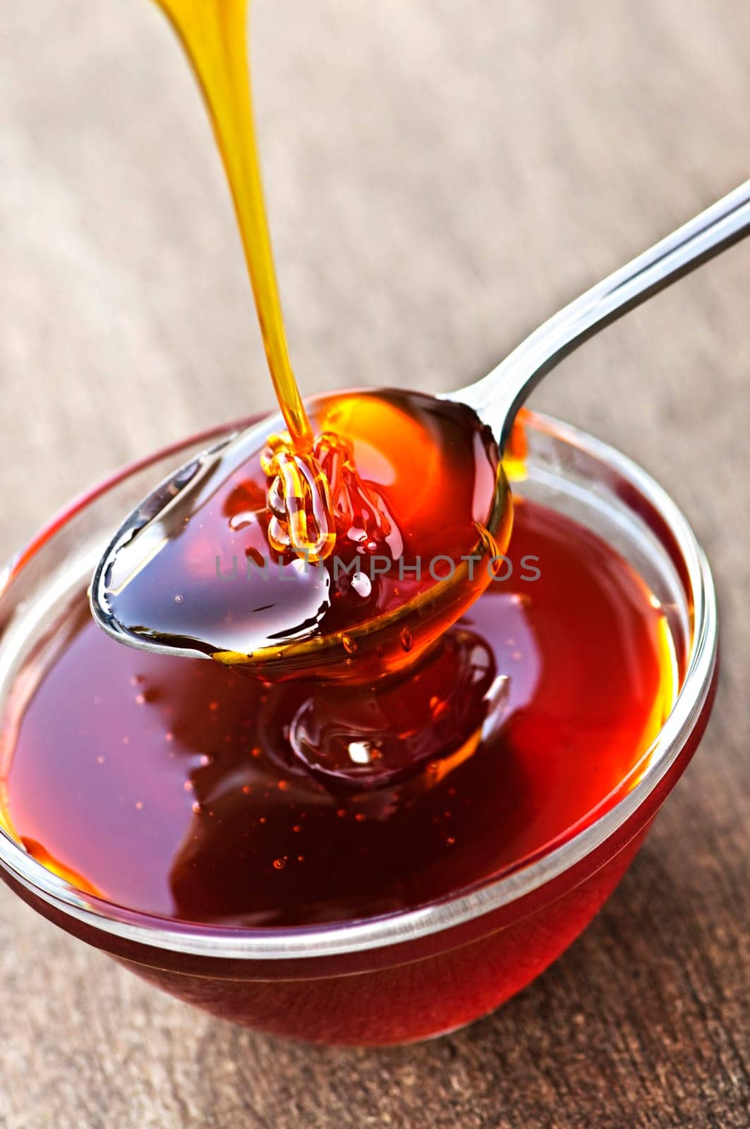Honey dripping onto spoon