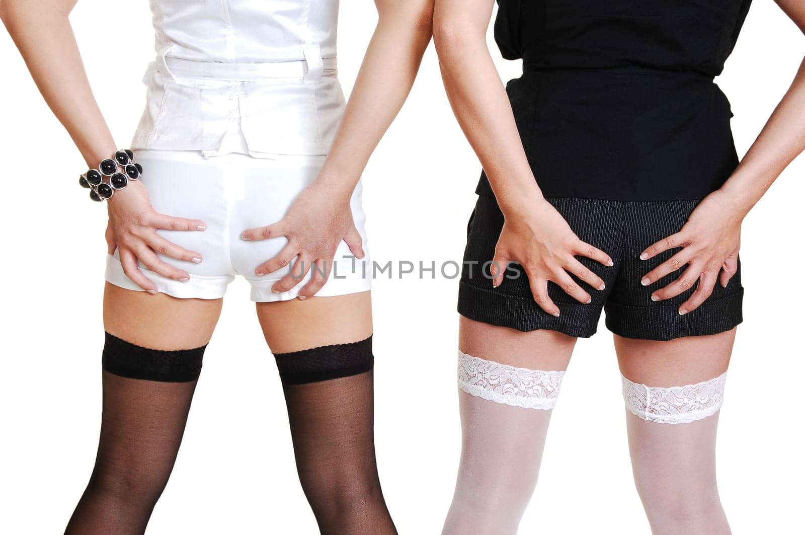 Two Chinese girl holding there butt.