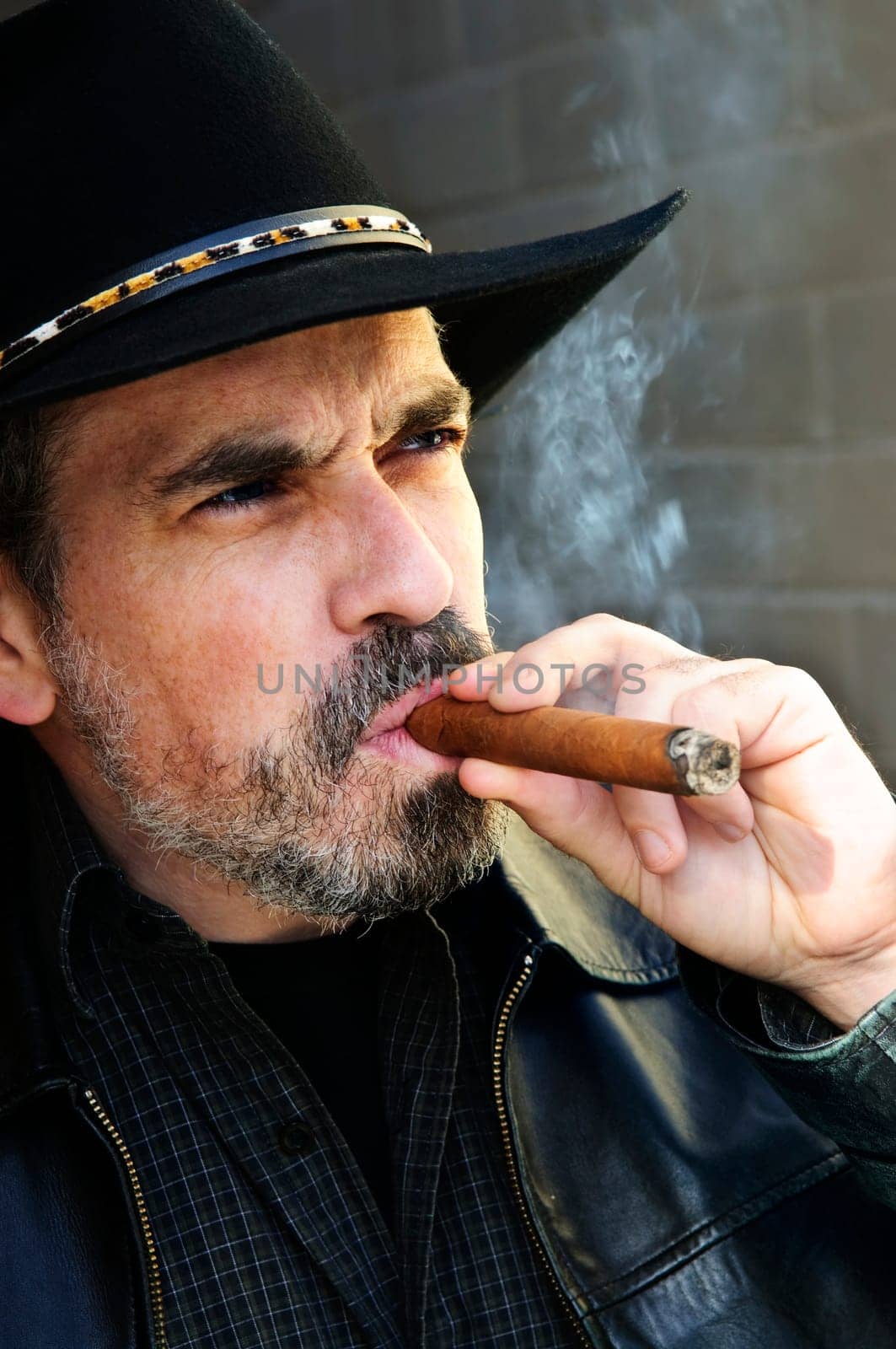 Bearded man smoking cigar