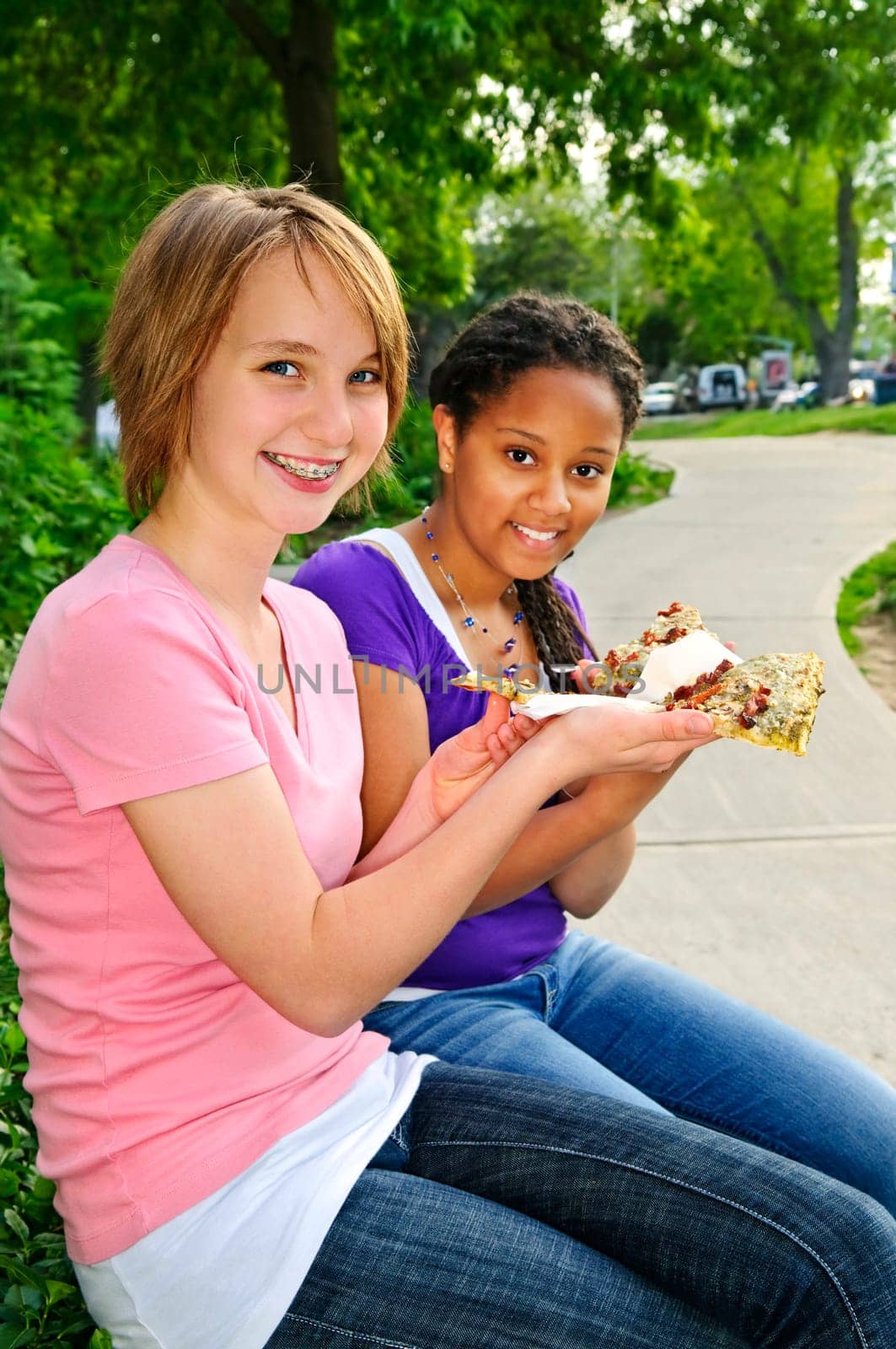 Girls eating pizza