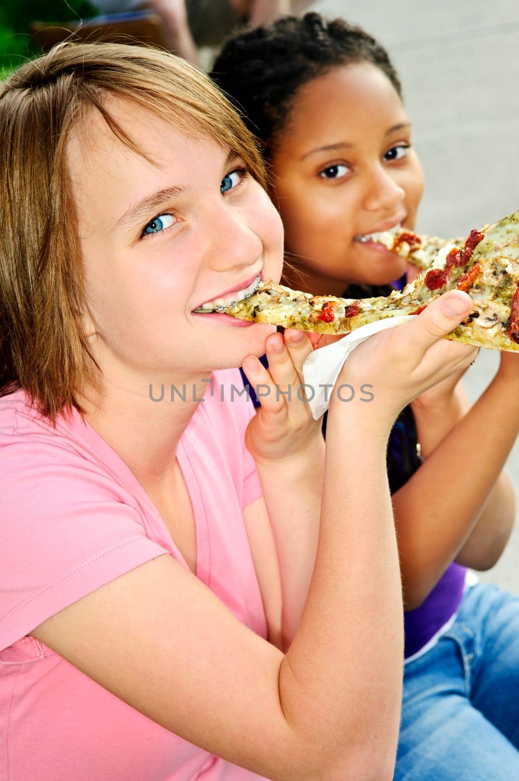Girls eating pizza