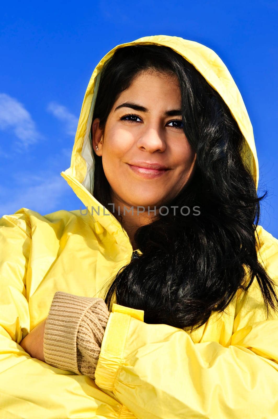 Beautiful young woman in raincoat
