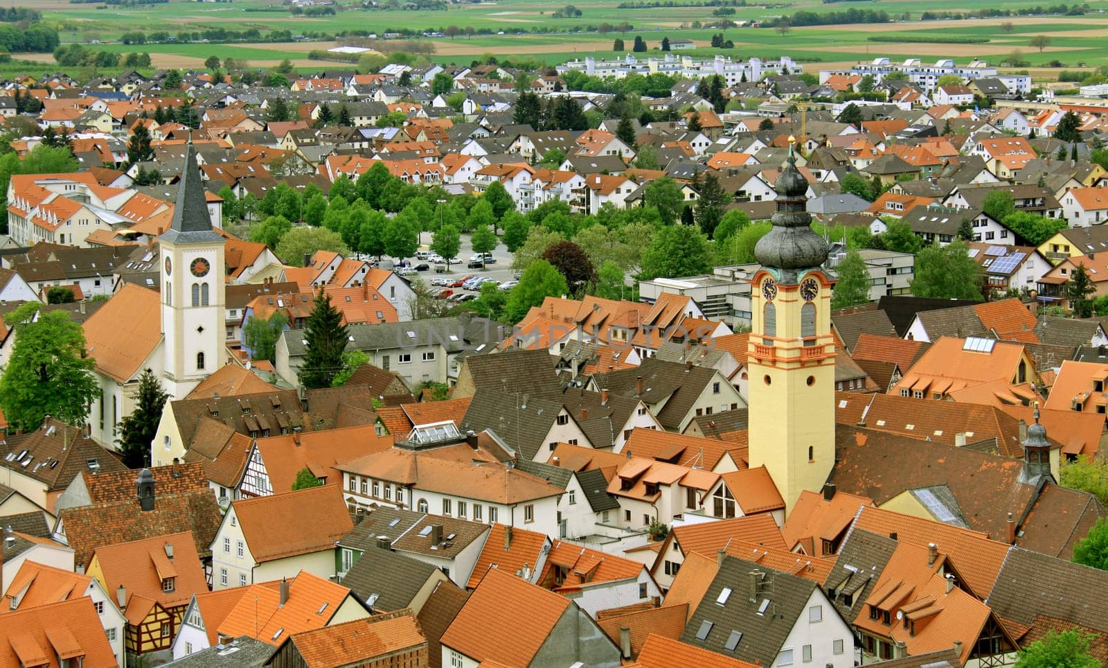 View from the Mount of Olives via Schriesheim to the northwest into the Rhine Valley Right: Catholic Parish Church of the Assumption of the Virgin Mary Left: Evangelical City Church of Schriesheim