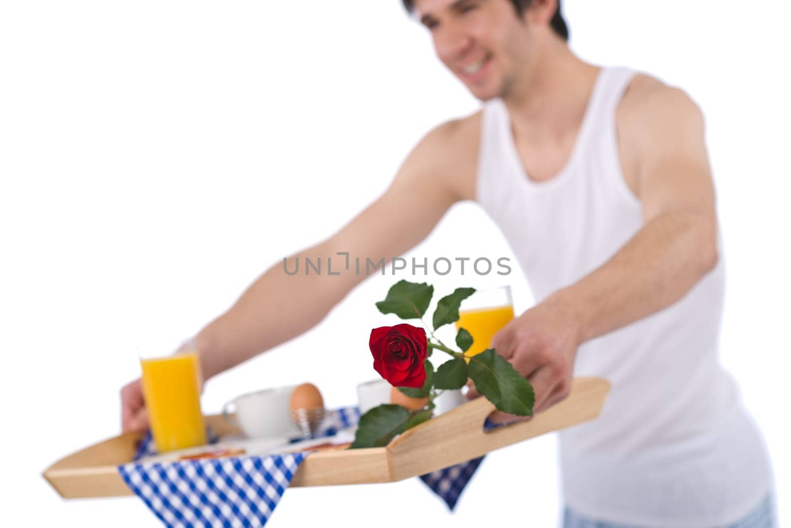 Breakfast - young man holding tray with rose