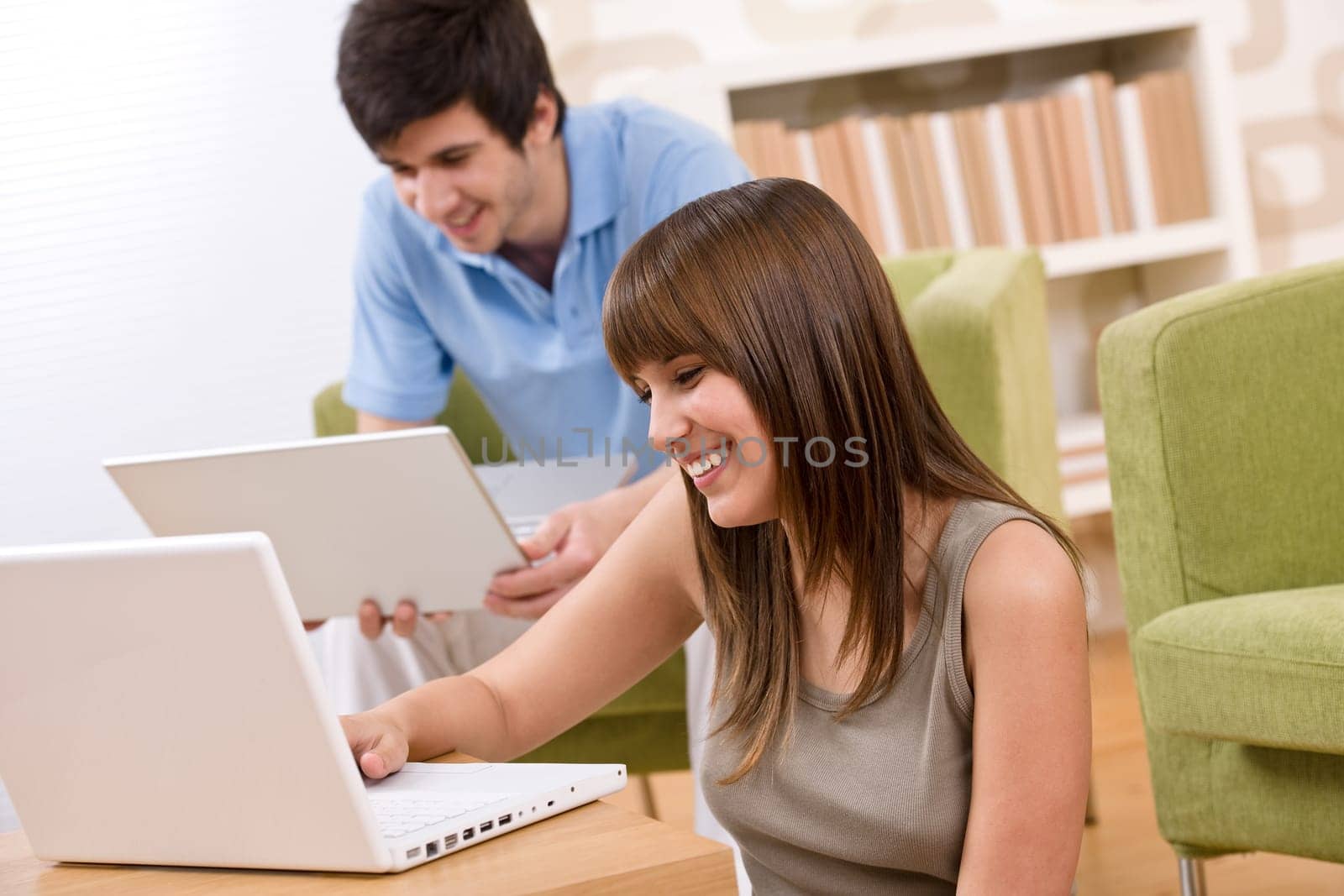 Student - two teenager with laptop in living room