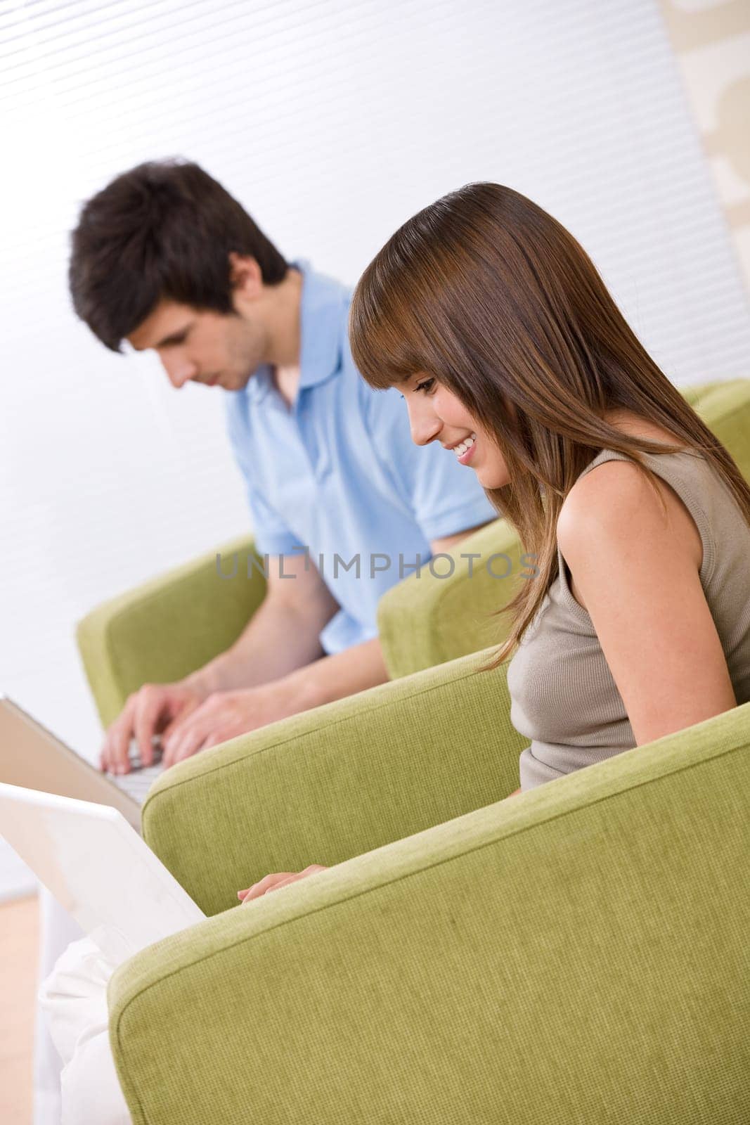 Student - two teenager with laptop in living room