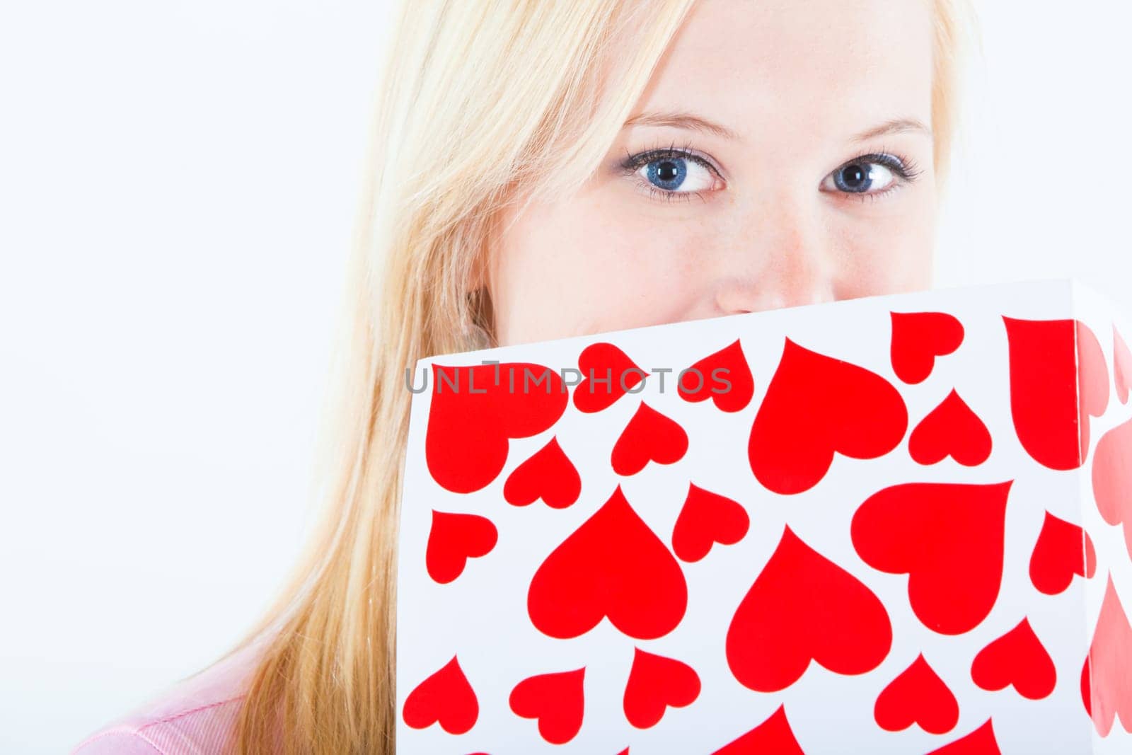 young blond woman with big valentine post card