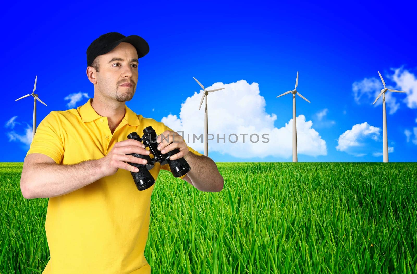 man and wind turbine landscape