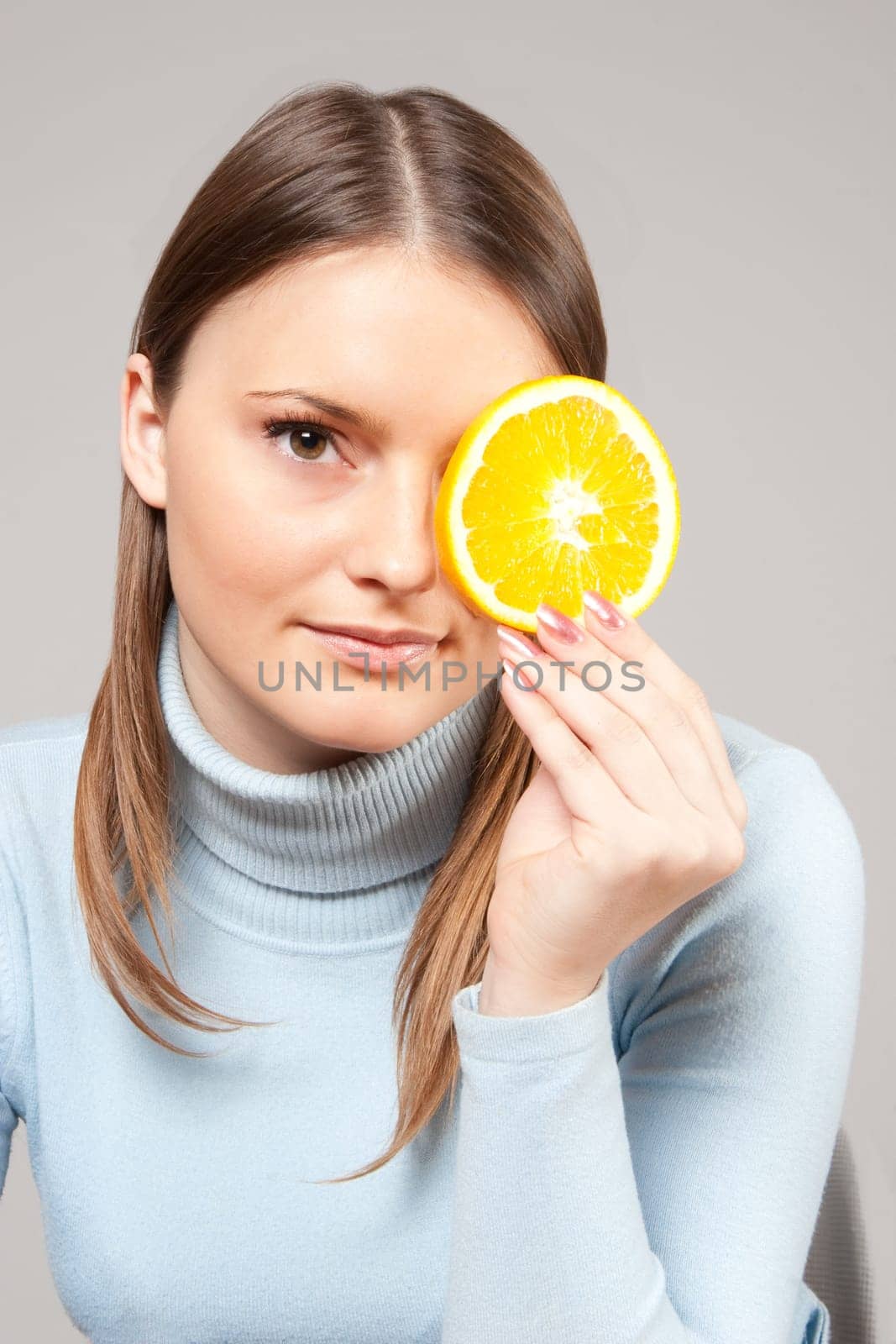 woman with red grapes