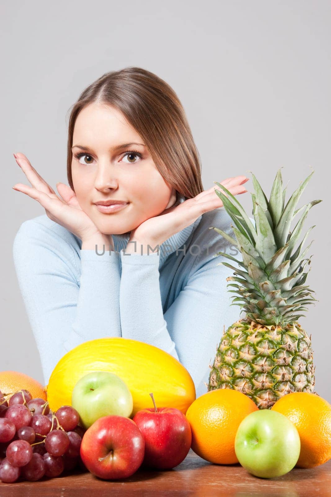 woman with red grapes