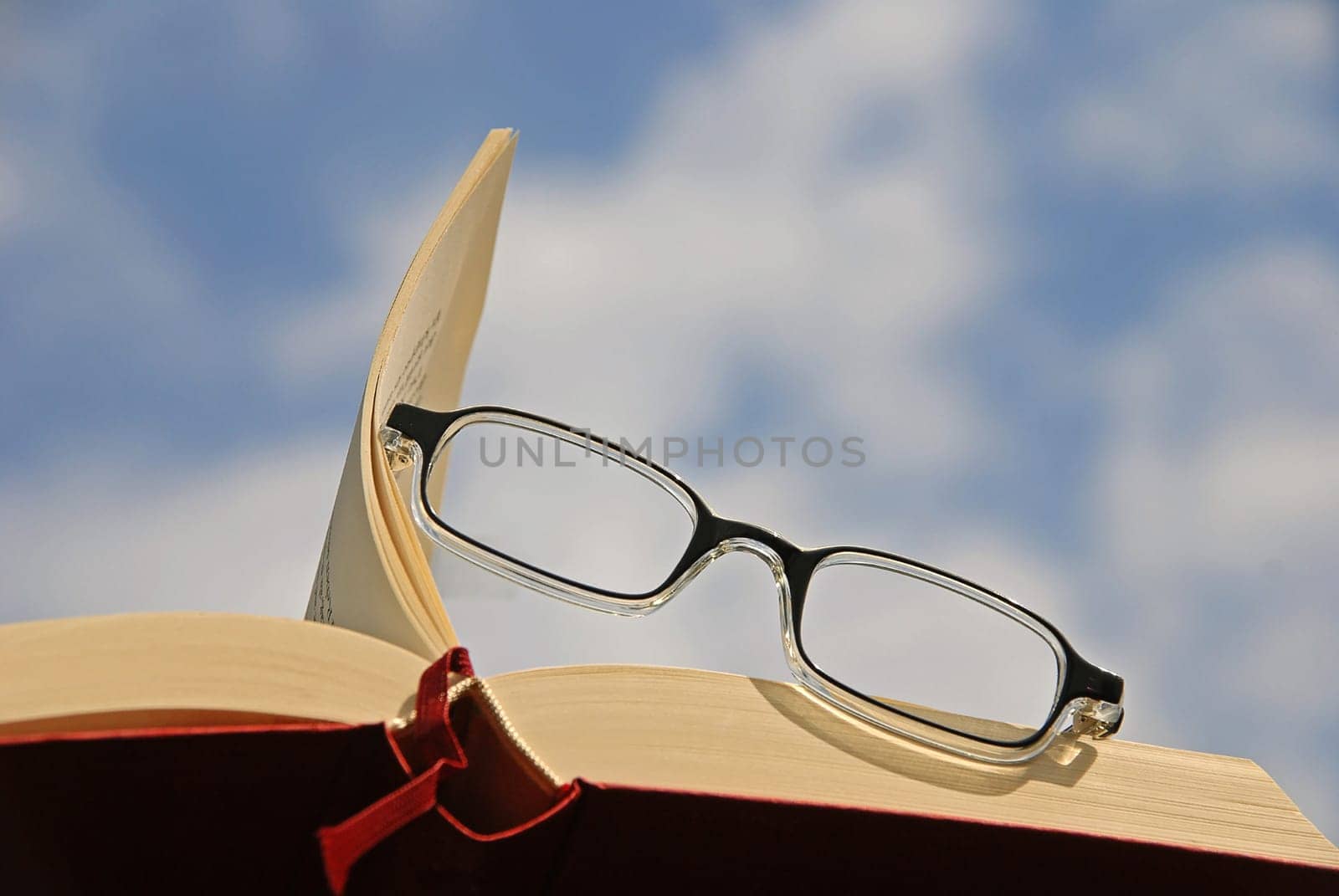Book with reading glasses