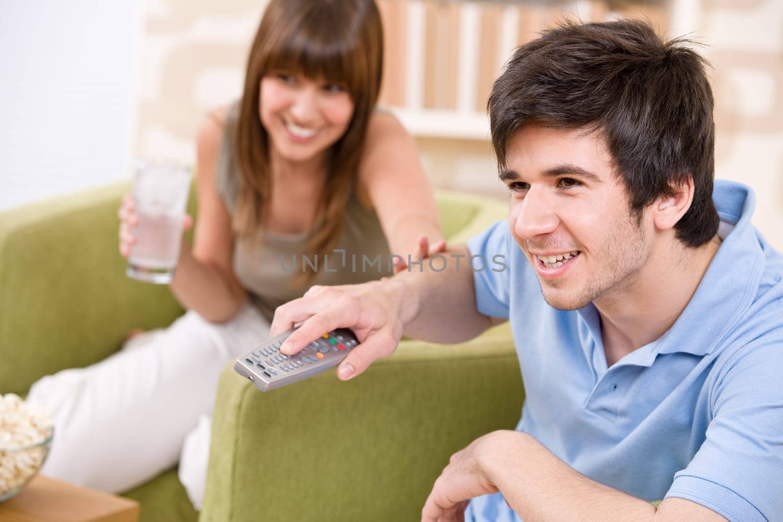 Student - happy teenagers watching television