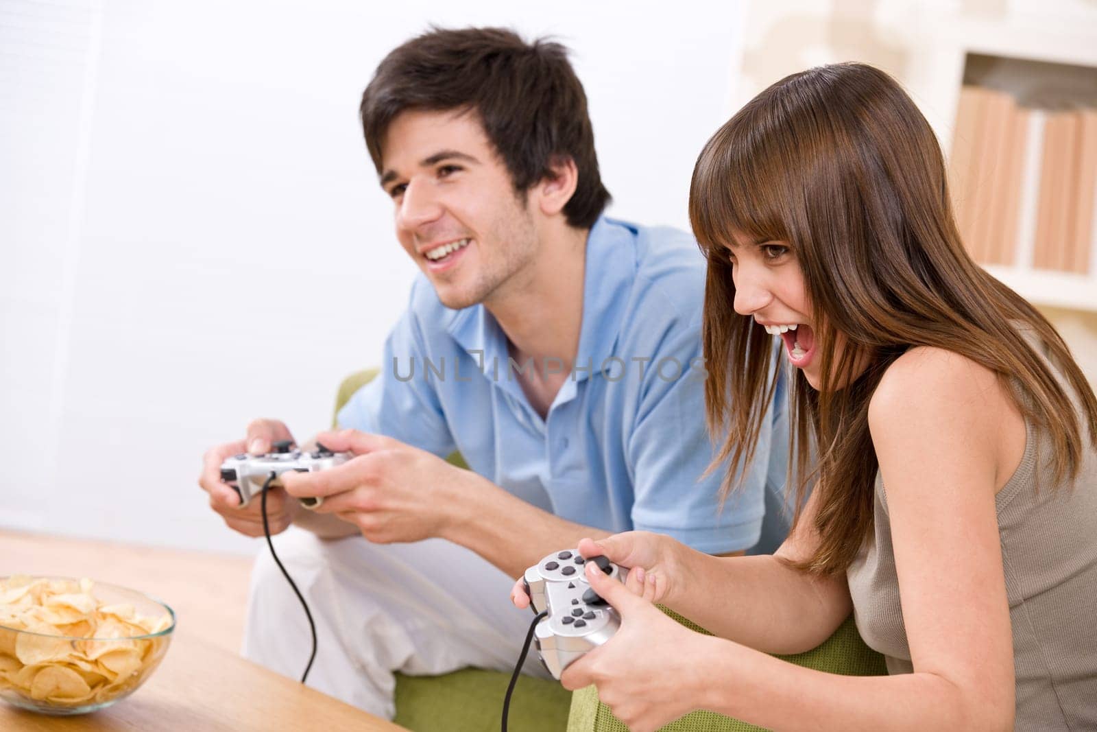 Student - happy teenagers playing video game