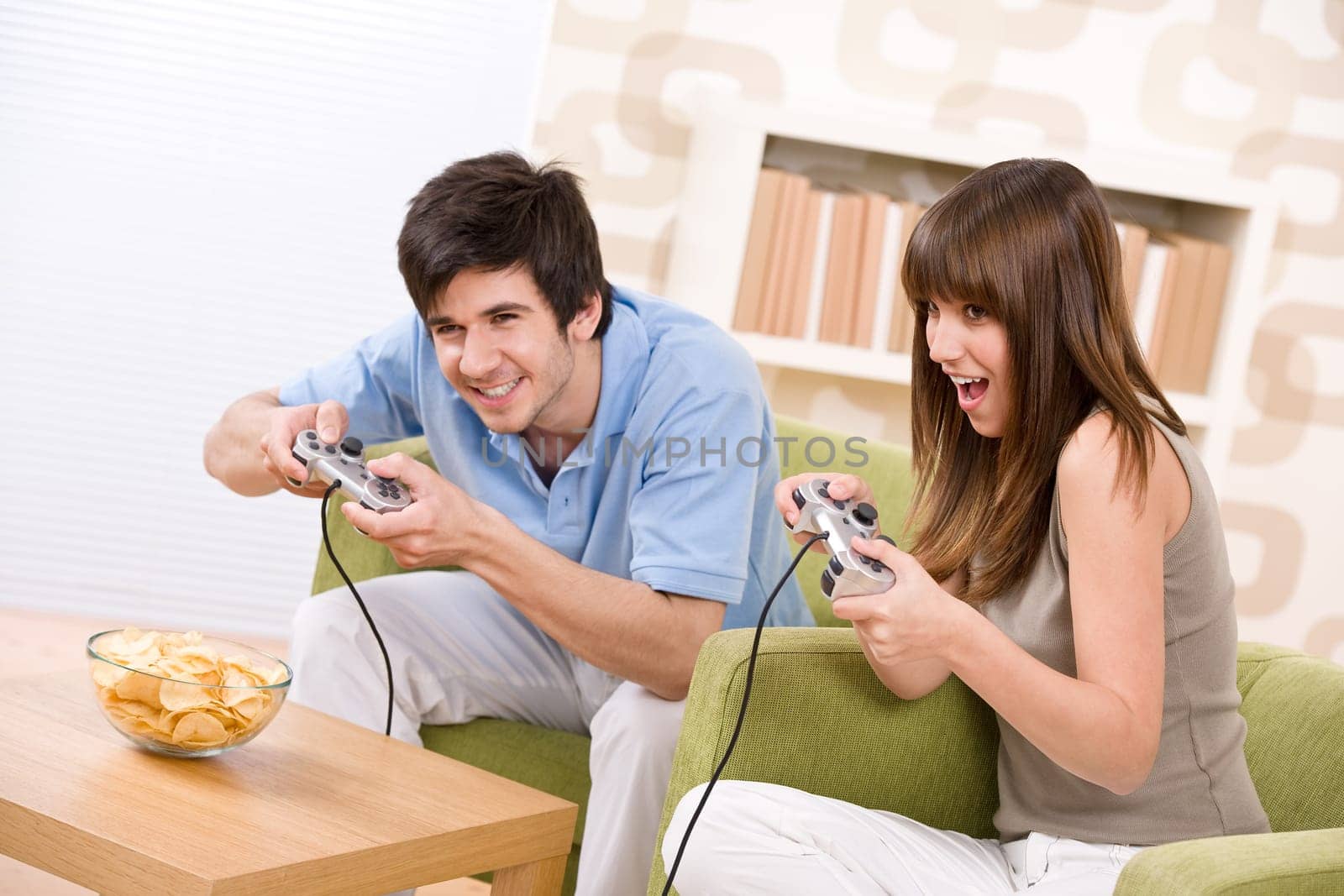 Student - happy teenagers playing video game