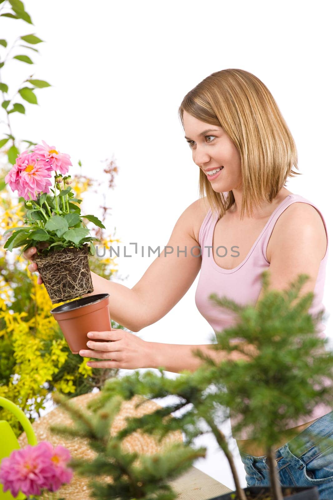 Gardening -  woman holding flower pot with flower
