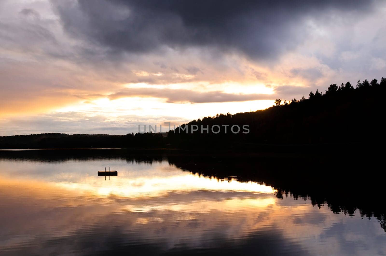 Lake sunset over forest