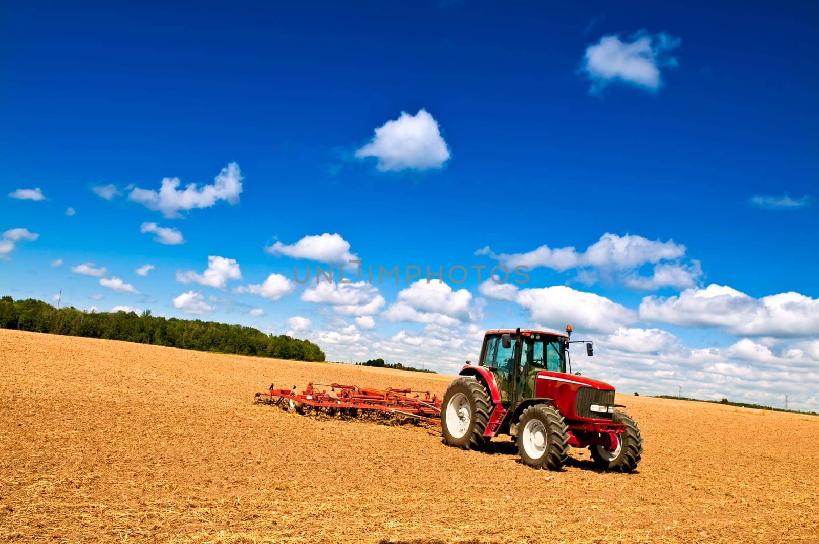 Tractor in plowed field