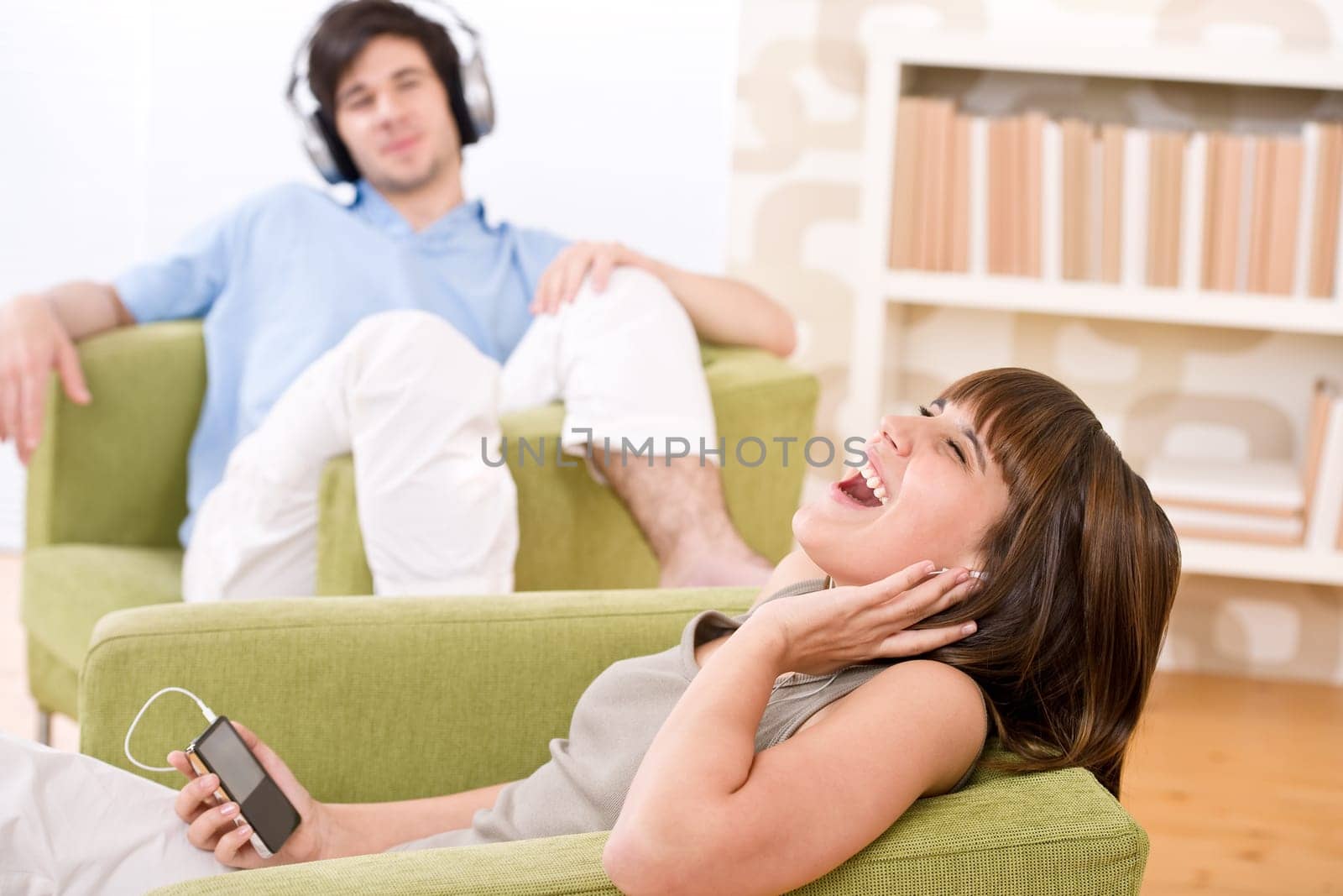 Student - Happy teenagers listen to music enjoying