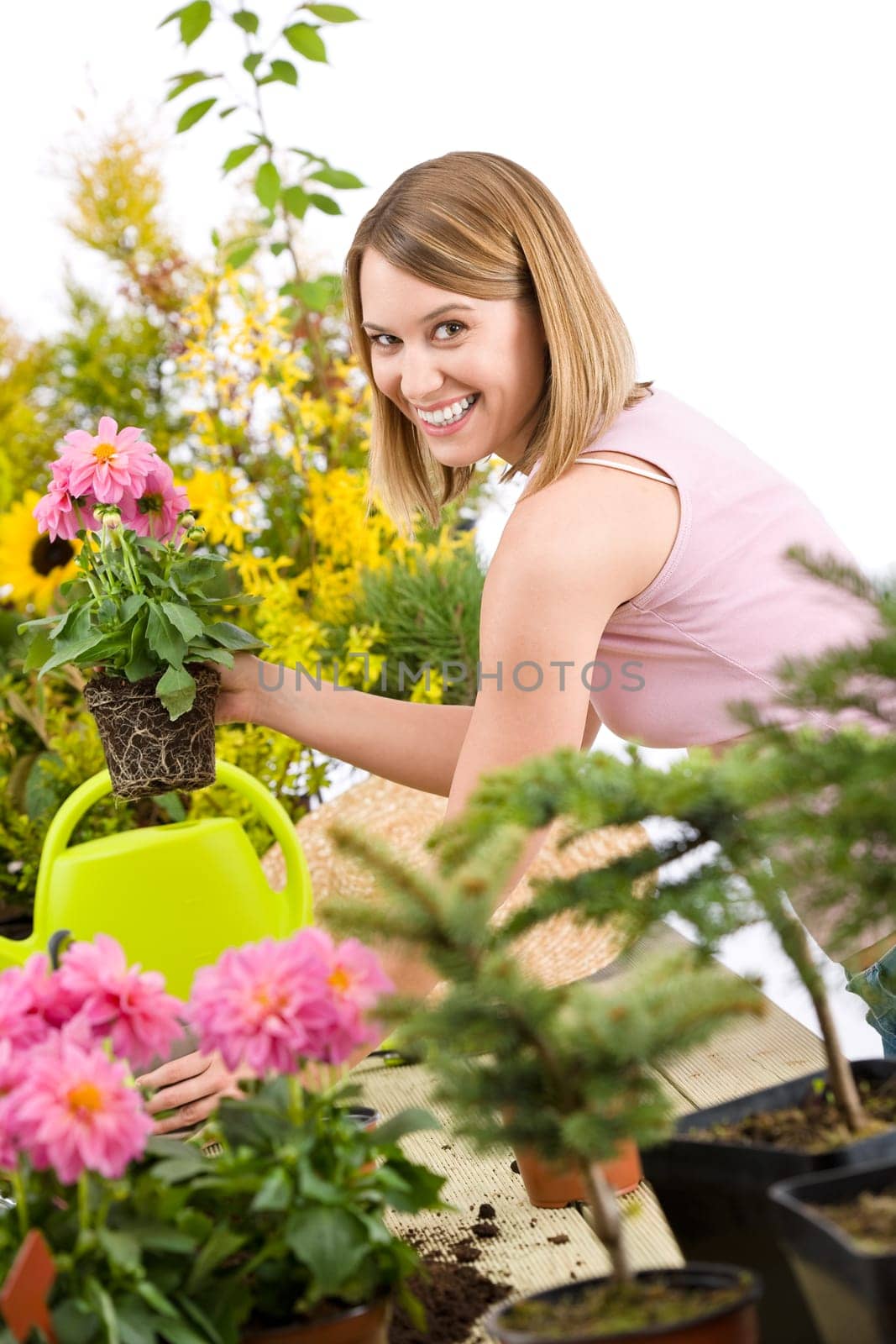 Gardening -  woman holding flower pot with flower
