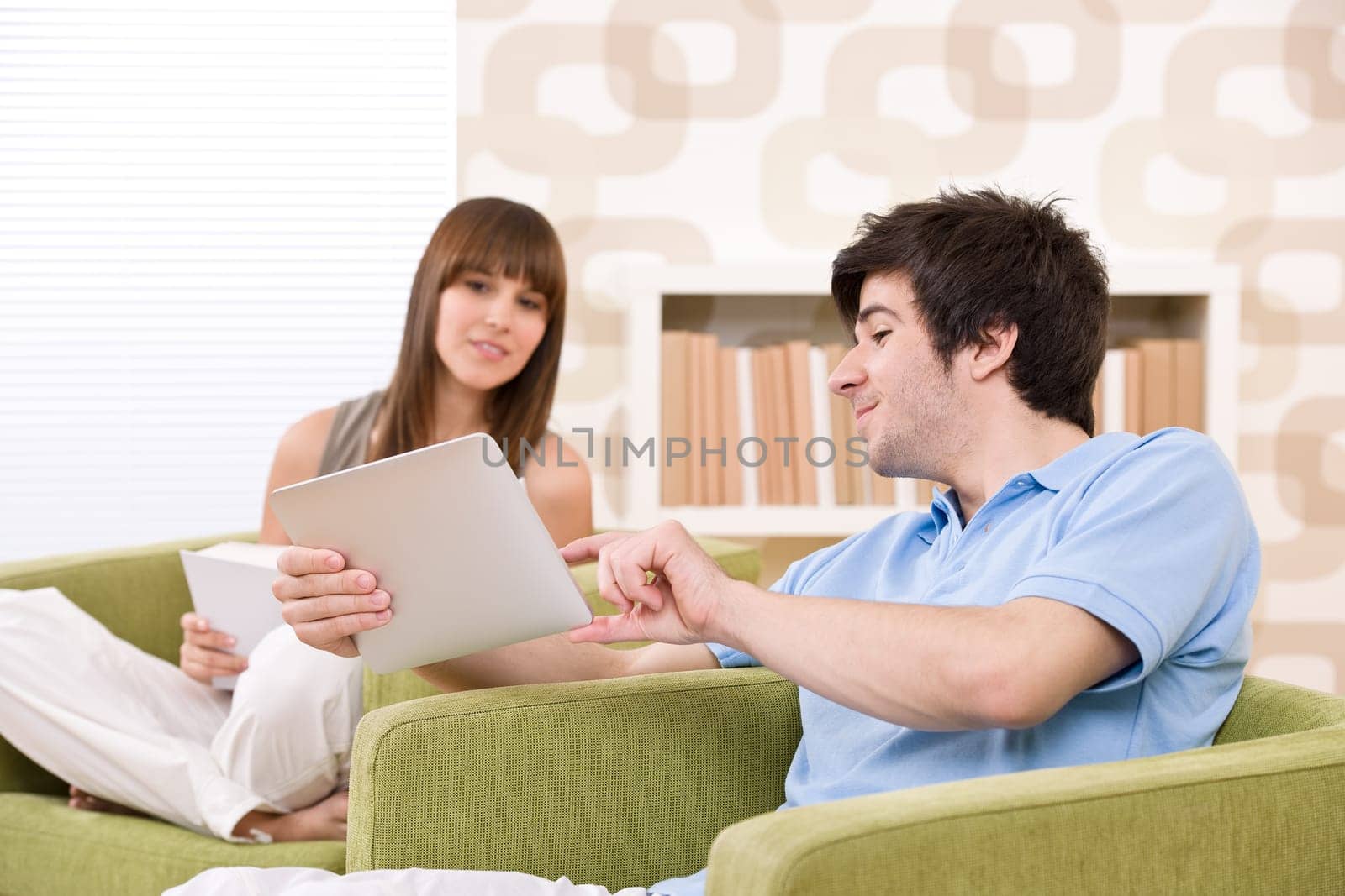 Student - young man with touch screen tablet computer