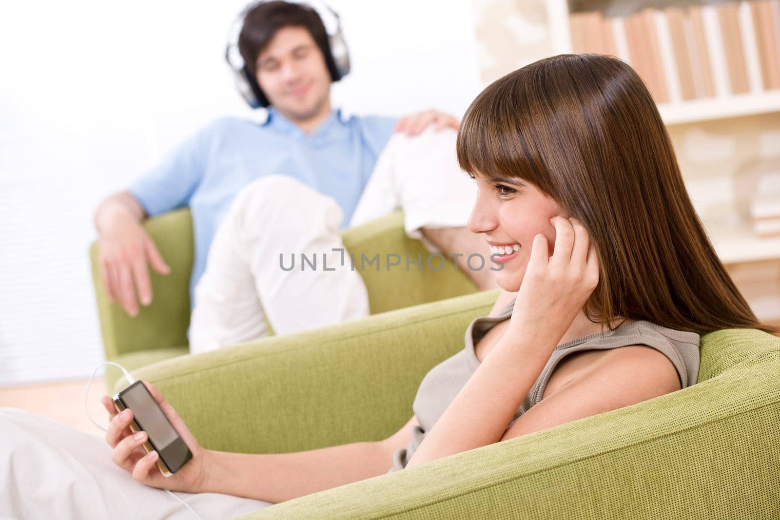 Student - Happy teenagers listen to music