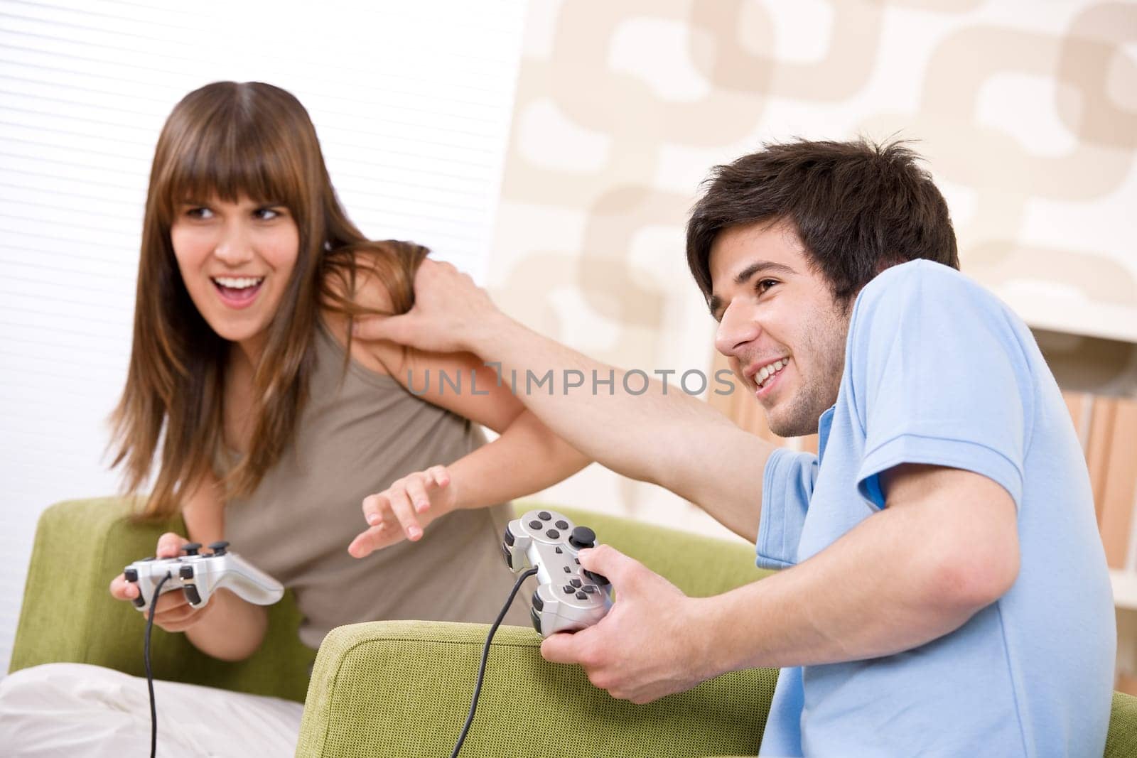 Student - happy teenagers playing video game