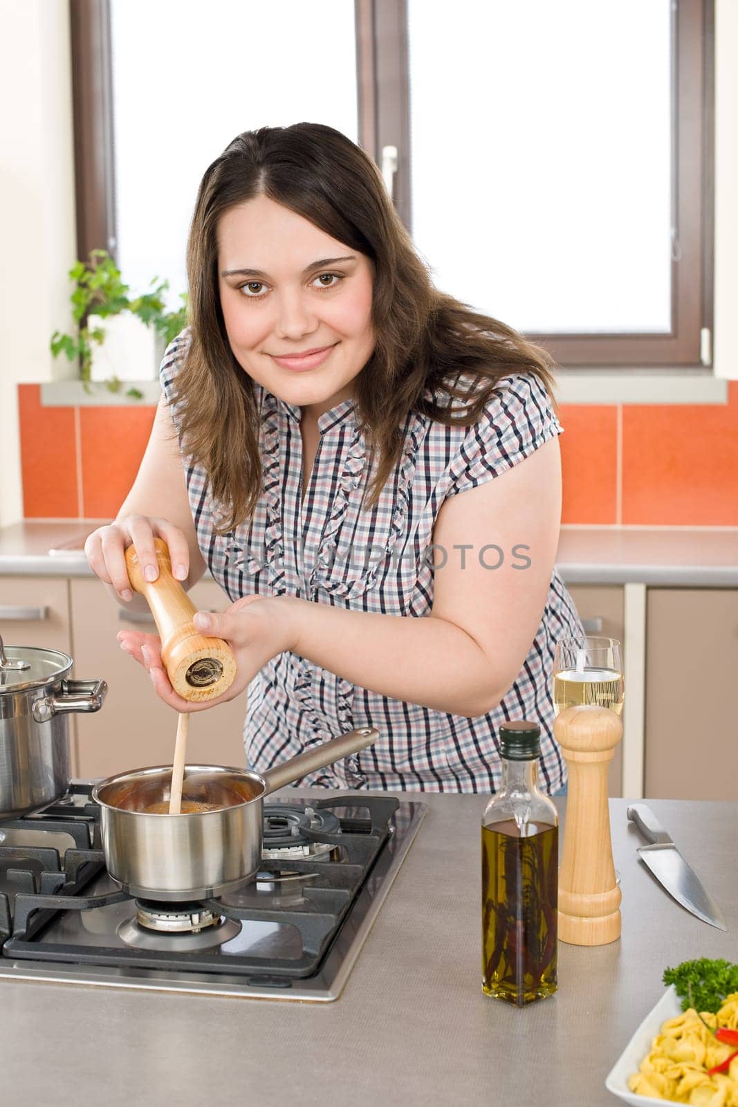 Cook - plus size woman preparing Italian food