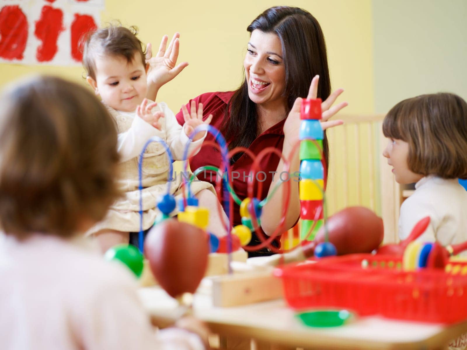 three little girls and female teacher in