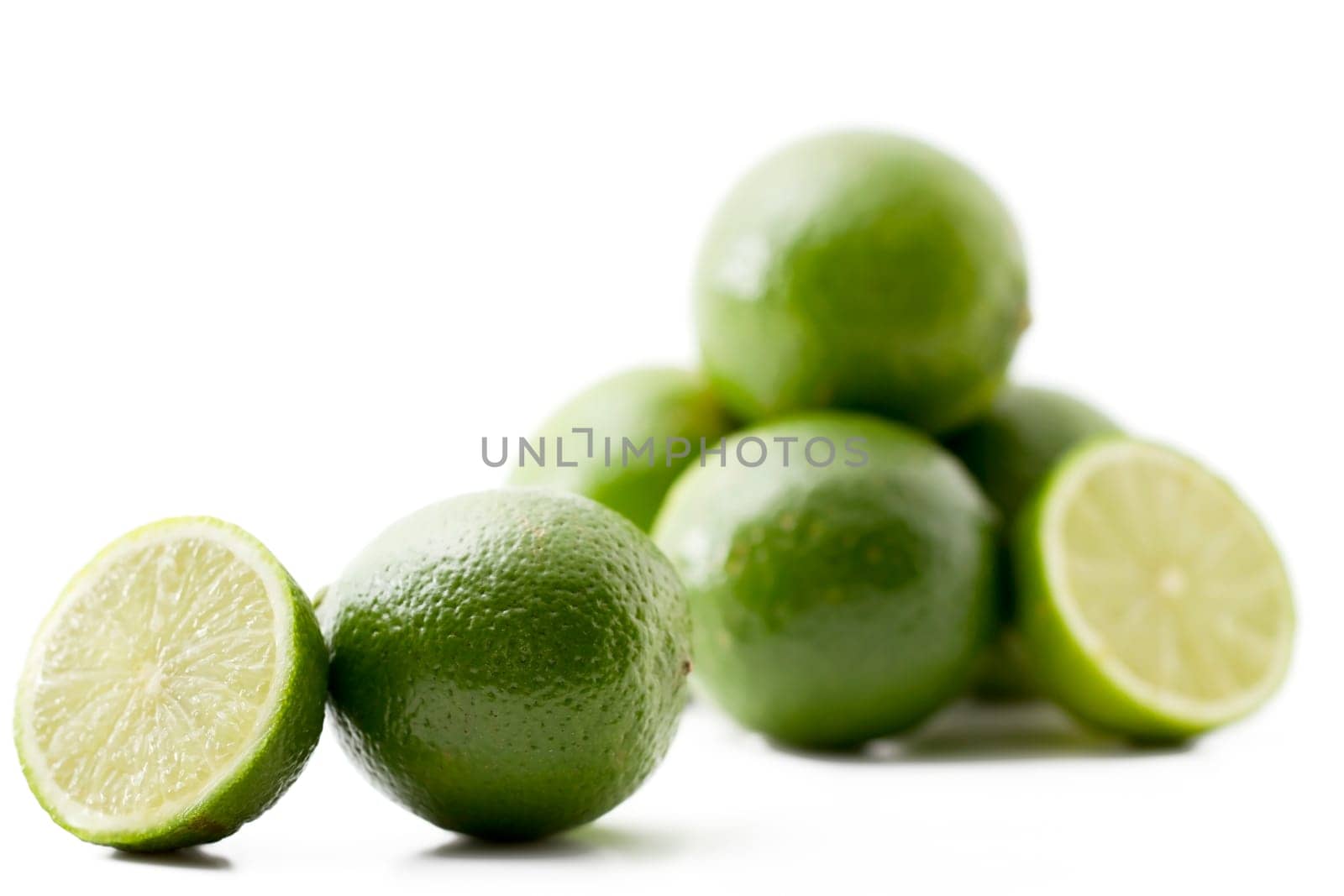 Half and whole lime and others in the background