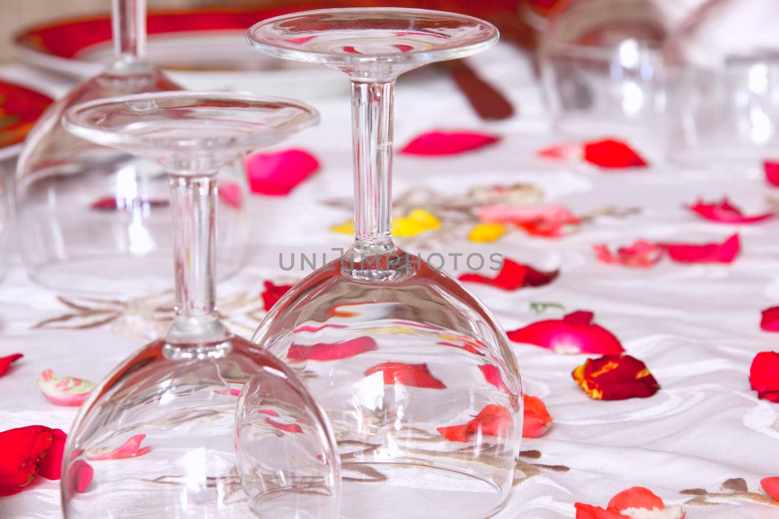 glasses on a table a white tablecloth wi