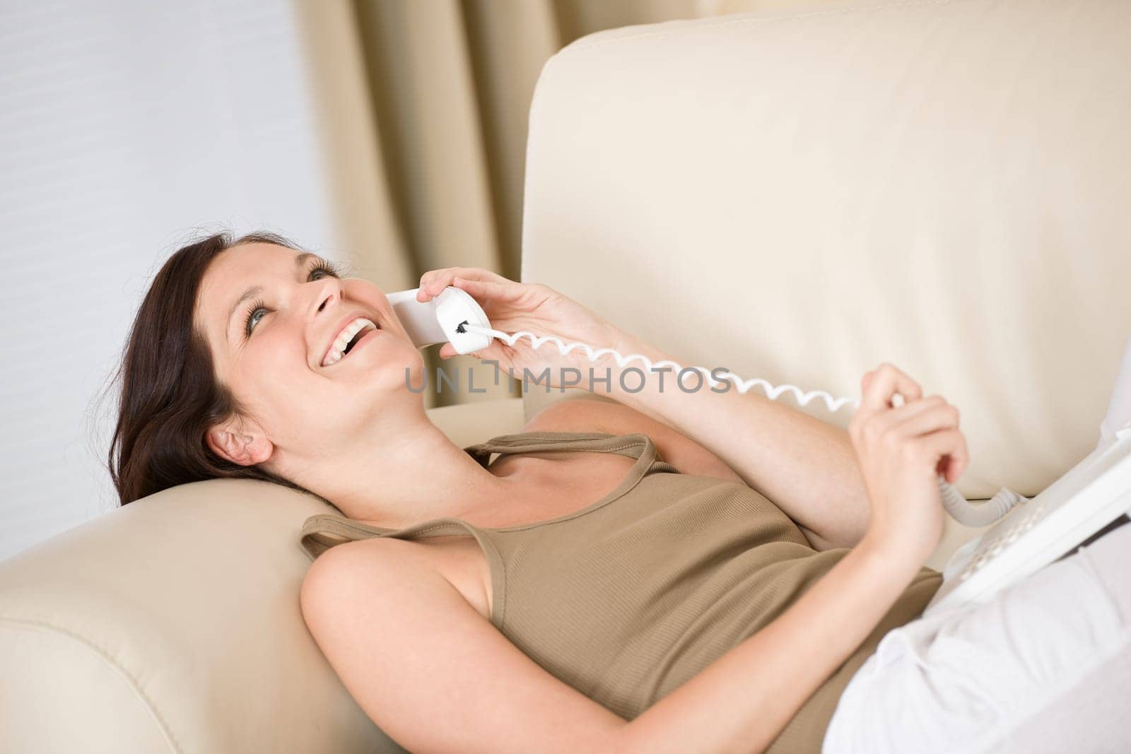 On the phone home Smiling woman calling