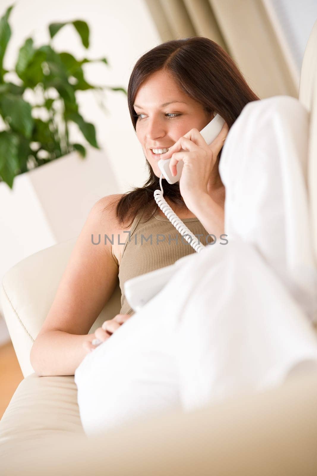 On the phone home Smiling woman calling