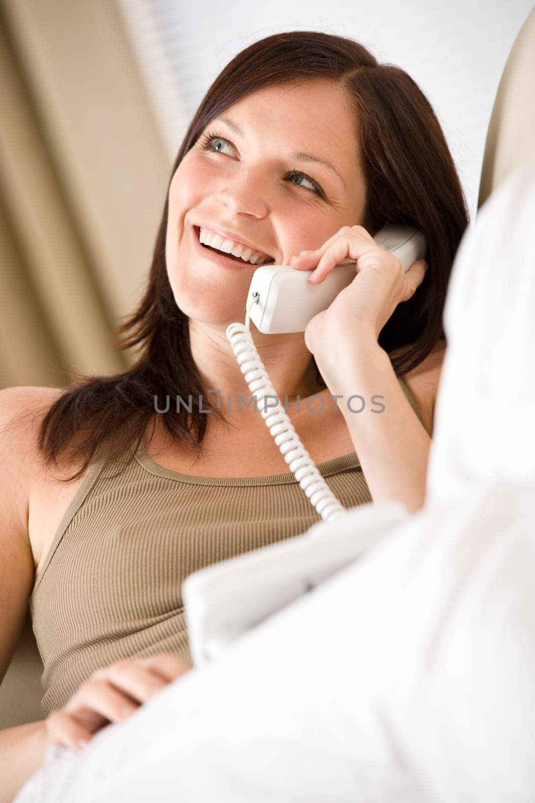 On the phone home Smiling woman calling