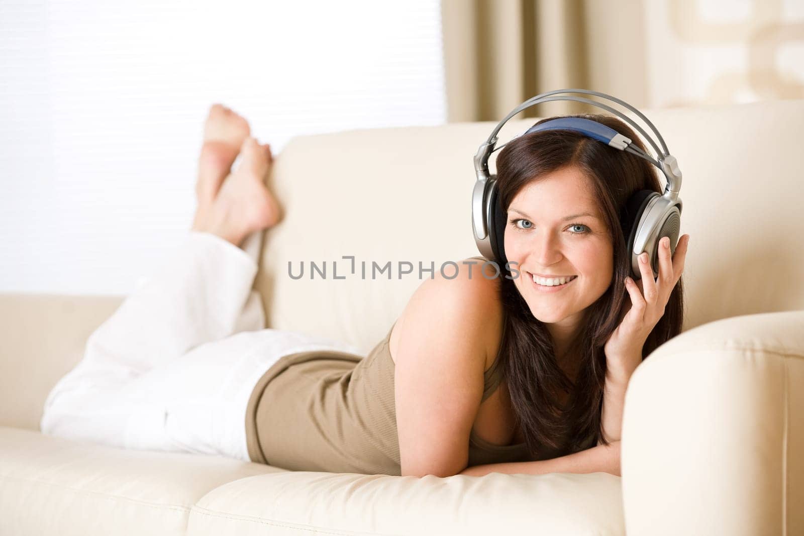 Woman listening music with headphones