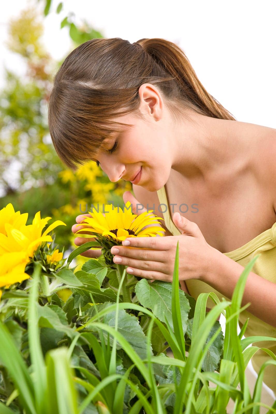 Gardening - portrait of woman with sunflower
