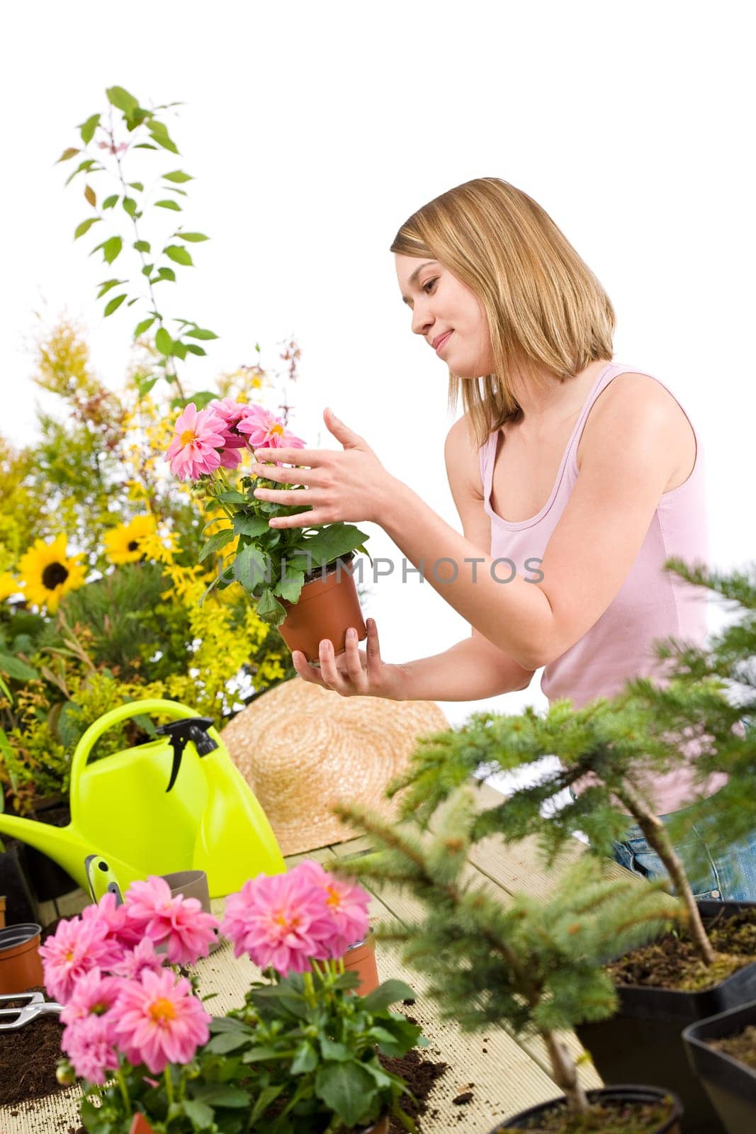 Gardening - Happy woman holding flower pot