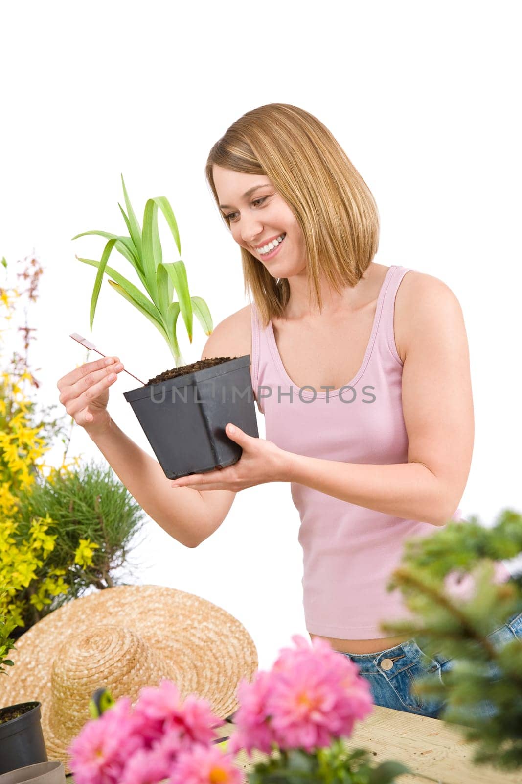 Gardening - Smiling woman holding flower pot