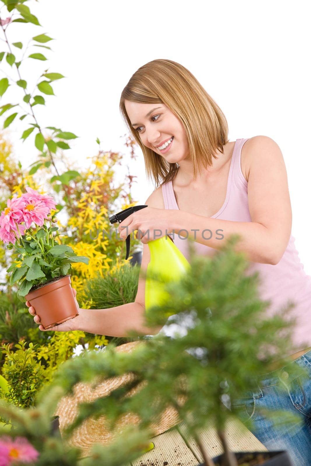 Gardening - woman sprinkling water to plant