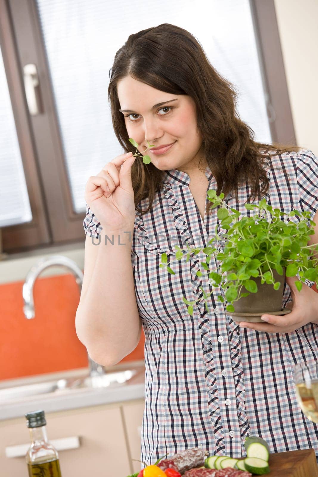 Cook - plus size woman with herb and vegetable