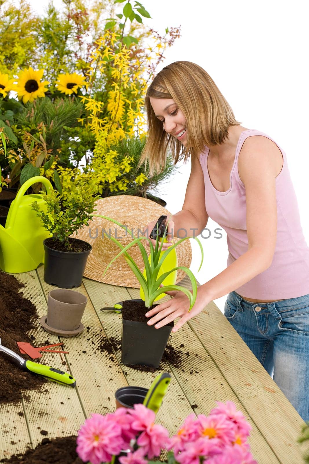 Gardening - woman sprinkling water to plant