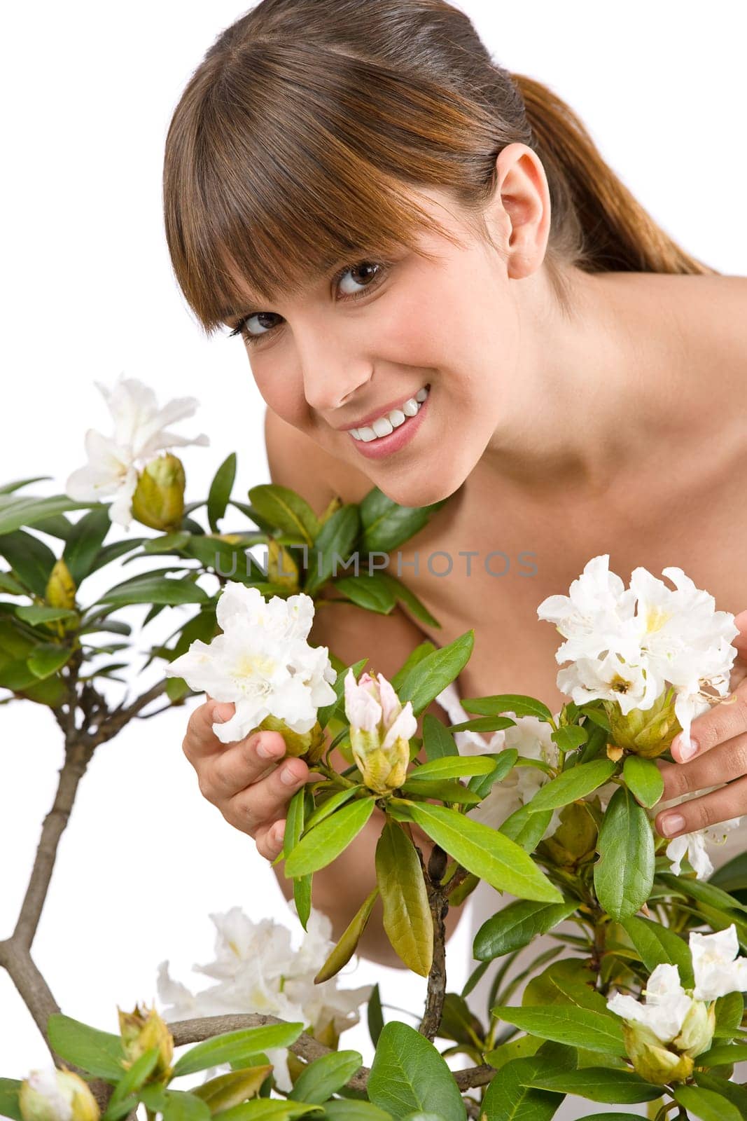 Gardening - Portrait of woman with Rhododendron flower