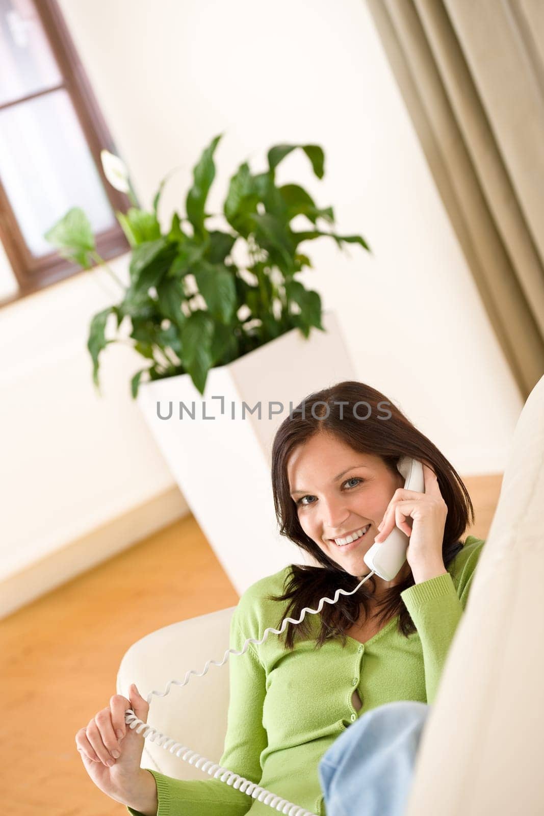 On the phone home Happy woman calling