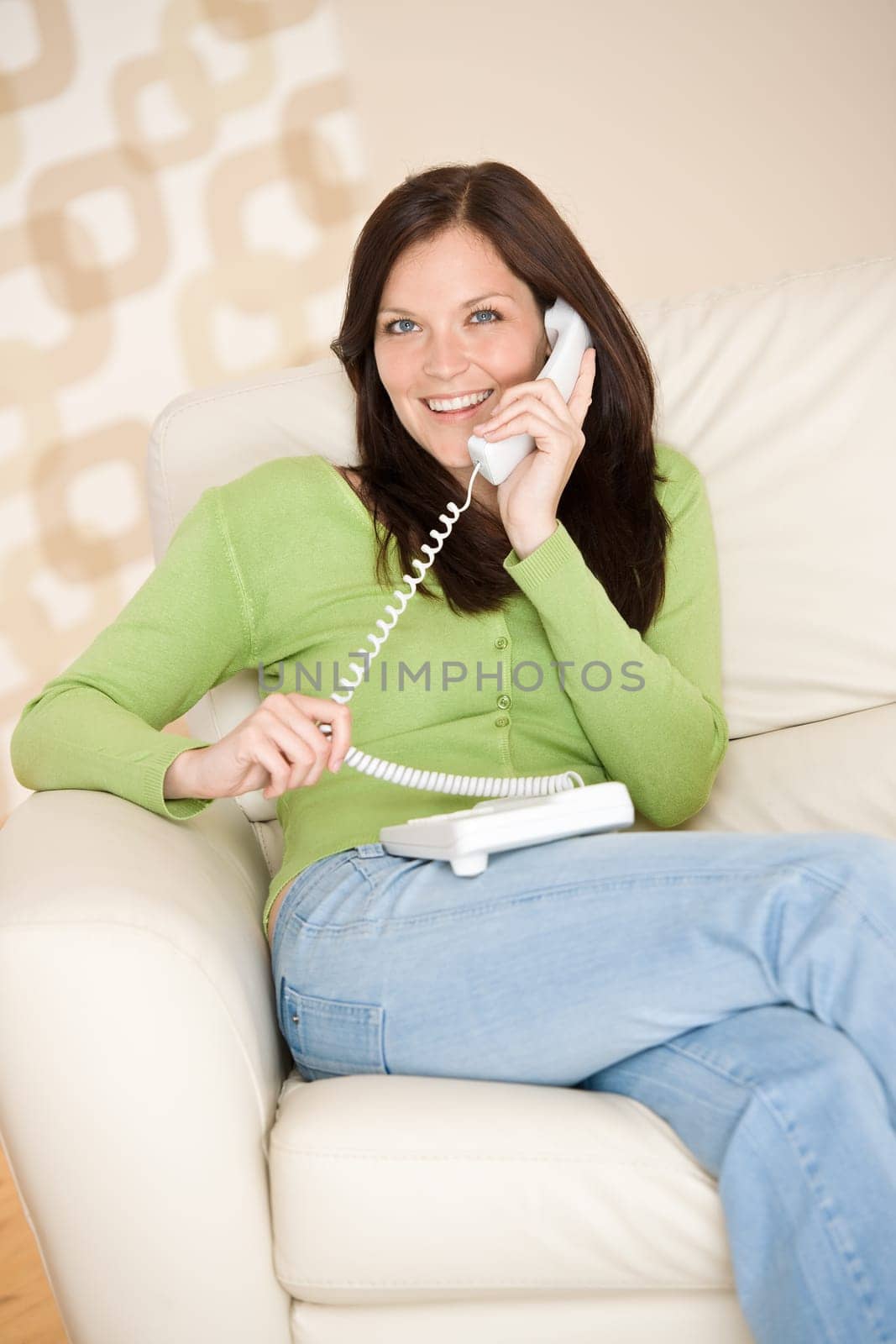On the phone home Smiling woman calling