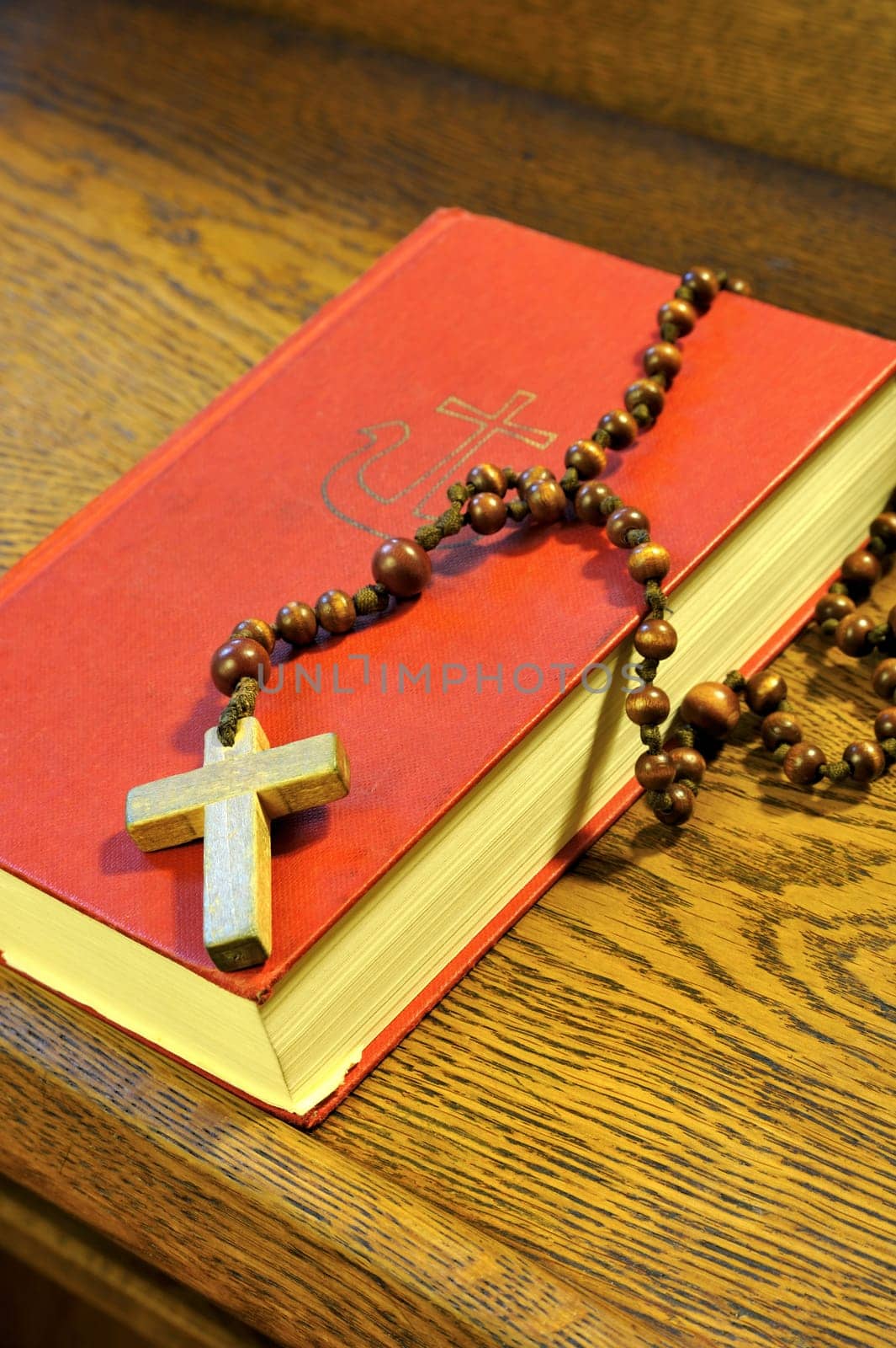 Hymnal book and wooden rosary bead- detail